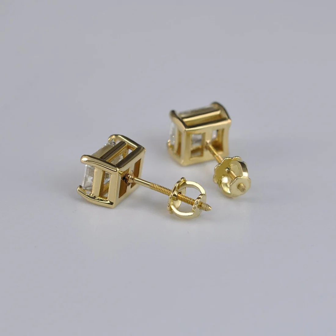 0.50 Each total 1.00 Carat Weight Emarald diamond studs.